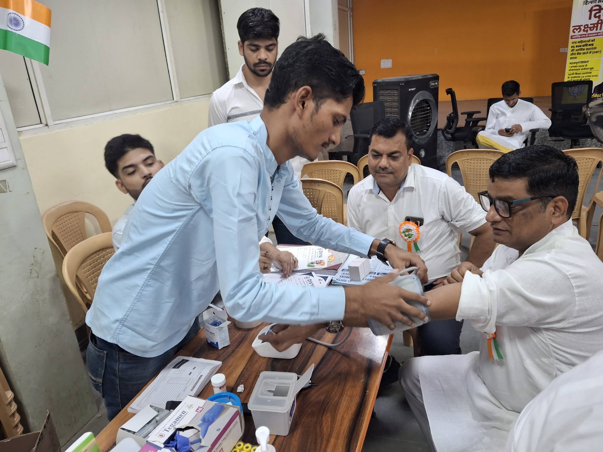DMLT phlebotomist taking blood sample at Divya Health Care clinic
